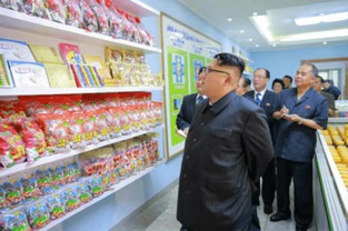 金正恩赞食品厂国产设备像美男子